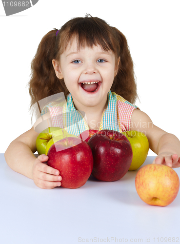 Image of Happy laughing girl with apples