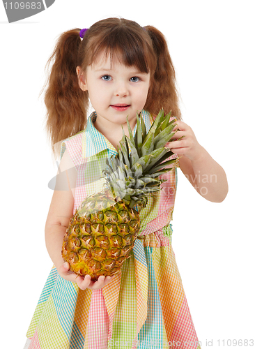 Image of Child holding large ripe pineapple isolated on white