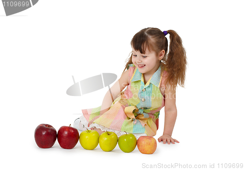 Image of Little girl on white background with apples