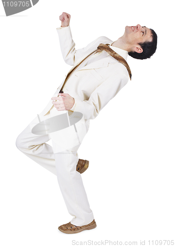 Image of Man in light suit loses balance after blow