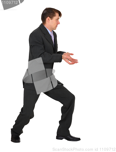 Image of Young businessman pushing