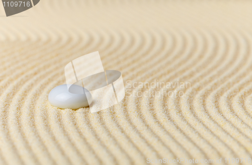 Image of Composition on Zen garden - sand, and glass drop