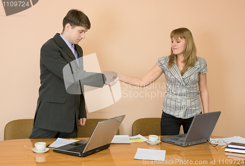 Image of Handshake men and young women