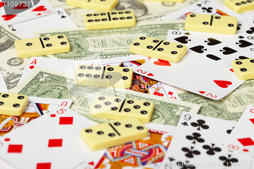 Image of Playing cards, dominoes and money