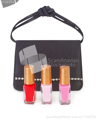 Image of Small handbag and vials of nail polish