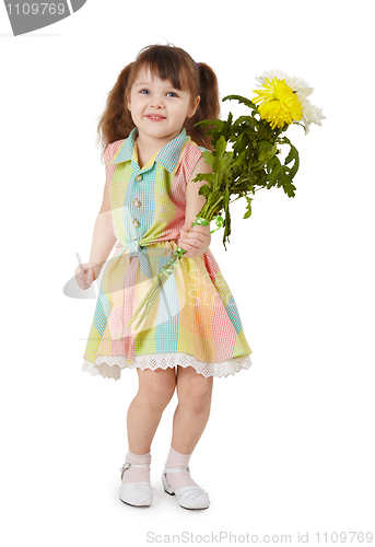 Image of Happy little girl with a bouquet of flowers