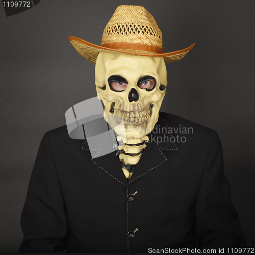Image of Skeleton in straw hat