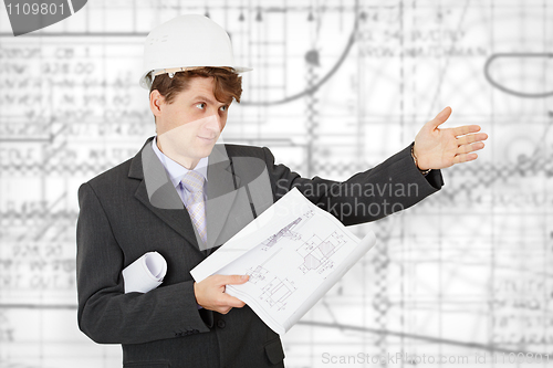 Image of Engineer in a helmet pointing direction
