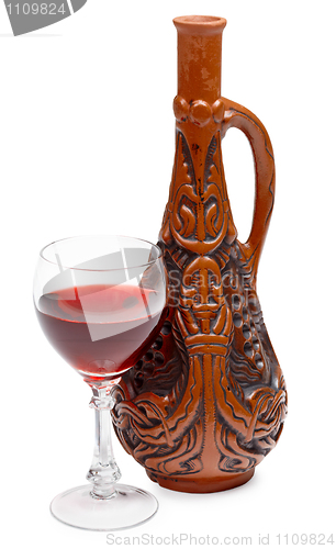 Image of Ancient Georgian bottle and glass of wine on white background