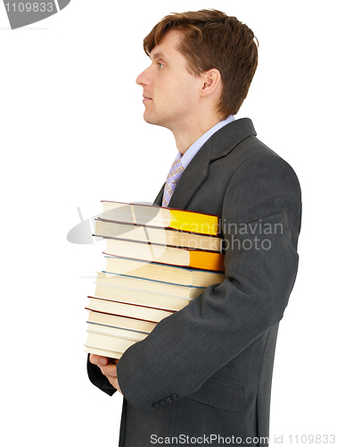 Image of Young man has stack of library books