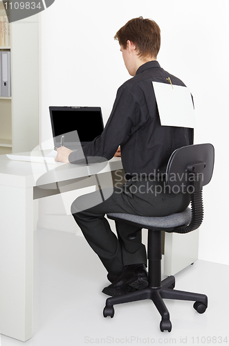 Image of Man working in office, attach to back poster