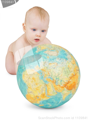 Image of baby playing with globe of earth