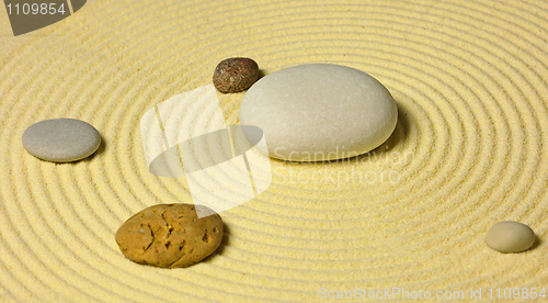 Image of Scheme of solar system from stones on sand