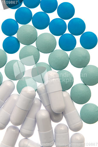 Image of White capsule, green and blue pills