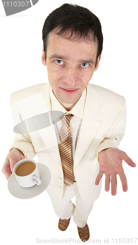 Image of Young man in white suit with coffee