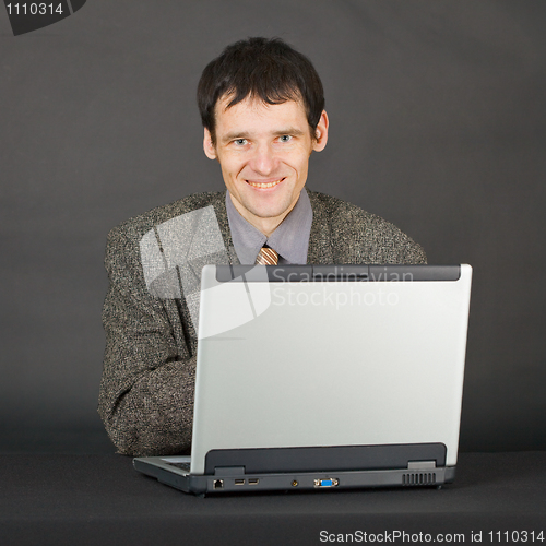 Image of Young man with computer