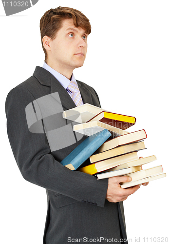 Image of Student holds a lot of books