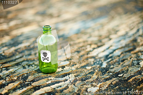 Image of Green glass bottle from poison
