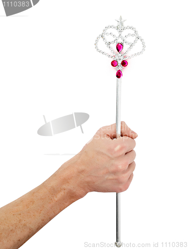 Image of Male hand holds magic wand - father gives gifts to children