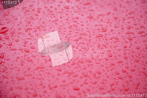 Image of polished car bonnet with water drops