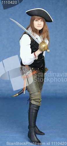 Image of Beautiful woman in pirate costume on blue background