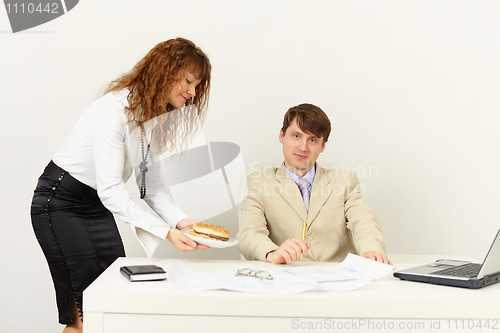 Image of Woman secretary brought a hamburger to superior