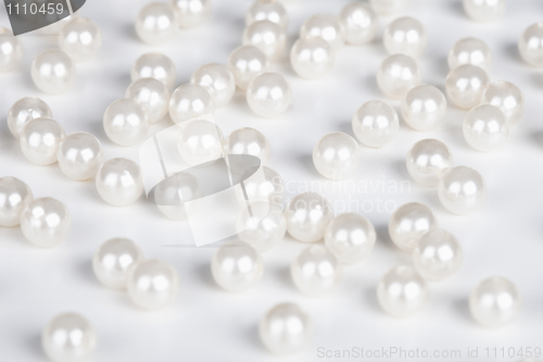 Image of Fake pearls scattered on table