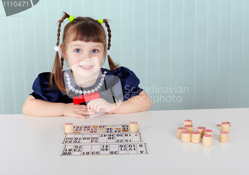 Image of Child at table played with bingo