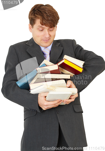 Image of Man - student hold heap of books and textbooks