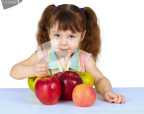 Image of Girl playing with big ripe apples