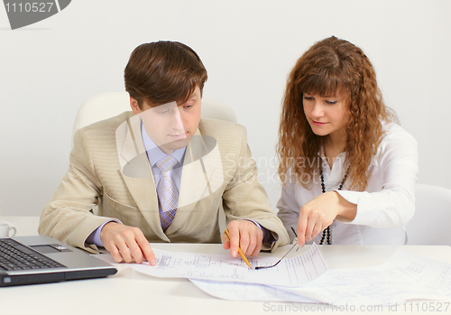 Image of Young engineers in office at work