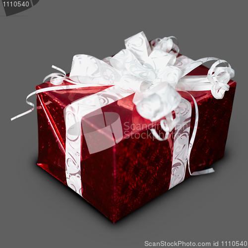 Image of Gift in red box with a ribbon