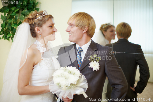 Image of Bride and groom looking at each other