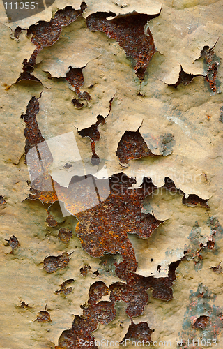 Image of Ragged old paint on steel wall