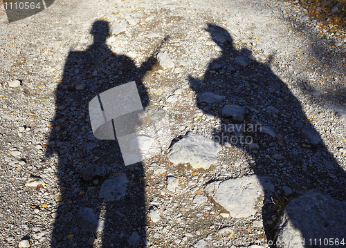 Image of Shadow of two armed men