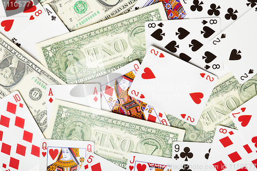 Image of Background of playing cards and money - theme of gambling