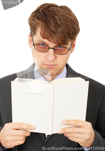 Image of Serious man gets acquainted with contents of book