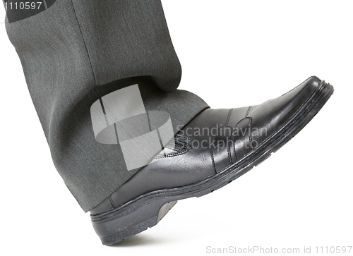 Image of Foot in a shoe ready to crush