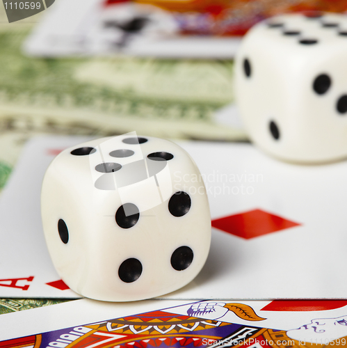 Image of Dice against cards and money