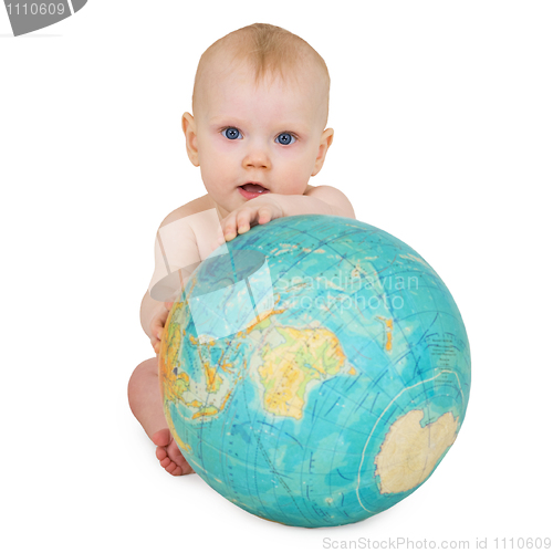 Image of Baby sitting on white background with globe