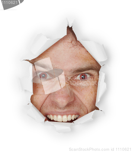 Image of Violent evil man looks through a hole