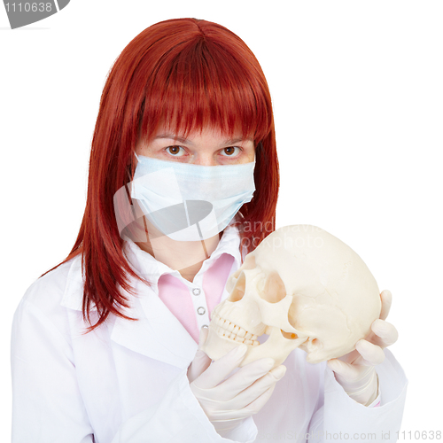 Image of Woman - nurse with skull in hands