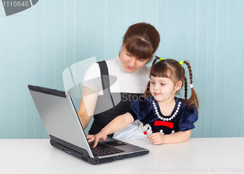 Image of Mother and daughter with a laptop