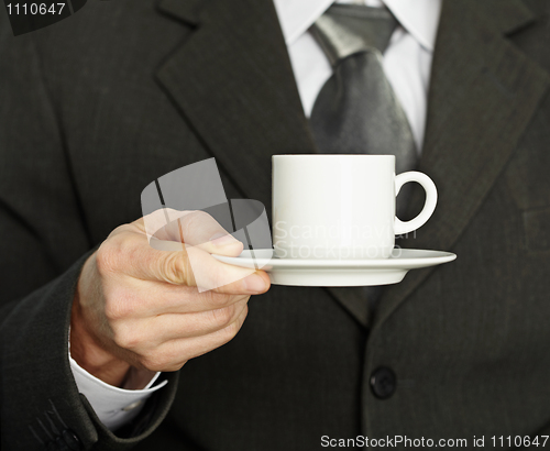 Image of Coffee cup in hand, a businessman - need a break