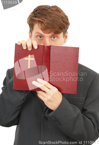 Image of Priest defends the Scriptures