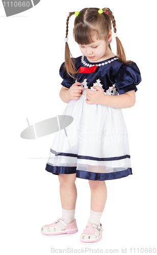 Image of Little girl in beautiful dress shy
