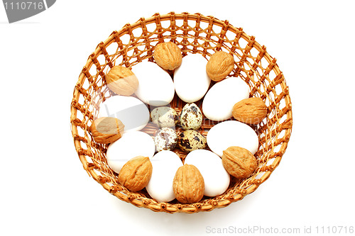 Image of Eggs and quail egg in the basket