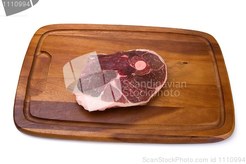 Image of Raw meat on the wooden board