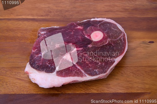 Image of Raw meat on the wooden board