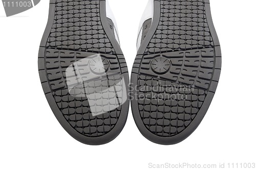 Image of Sneakers soles upward